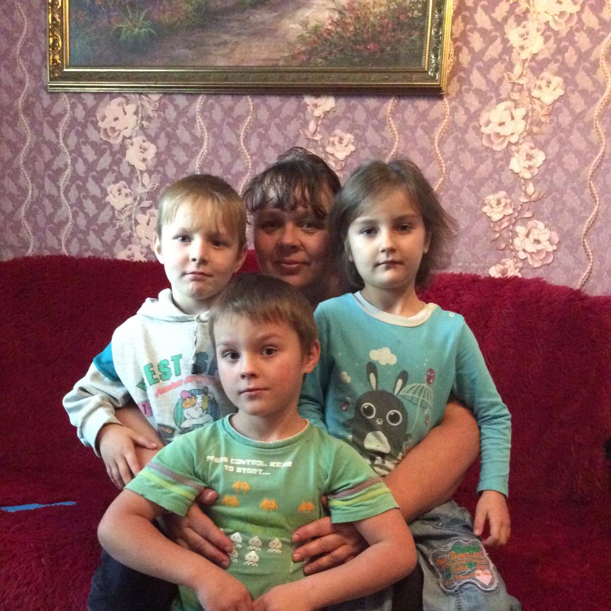 Tamara with Nikita, Kseniya, and Yura.