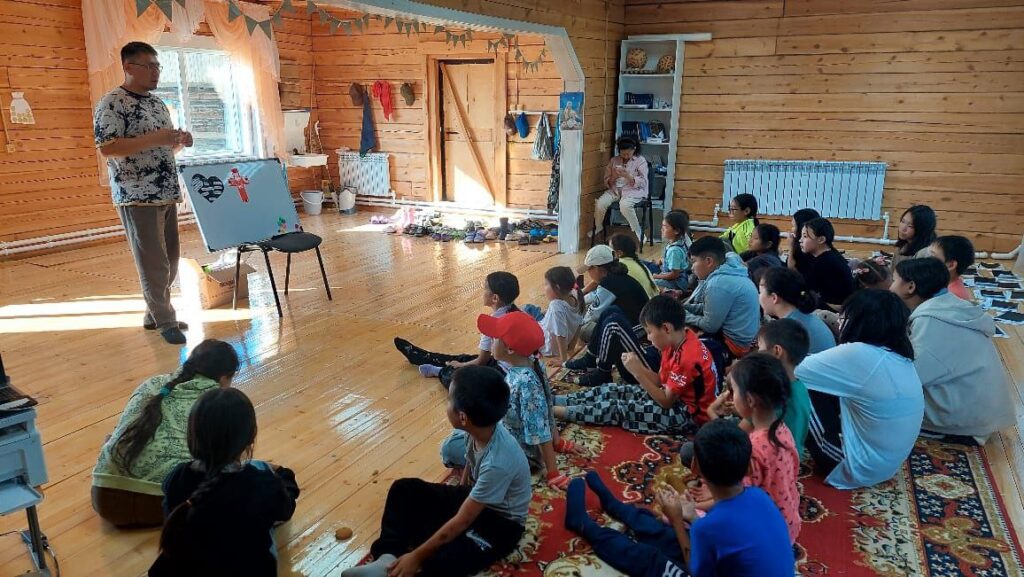 Alexei leads a youth meeting at the church.